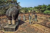 Angkor - Eastern Mebon - monolithic elephants at the corners of the platforms of the pyramid